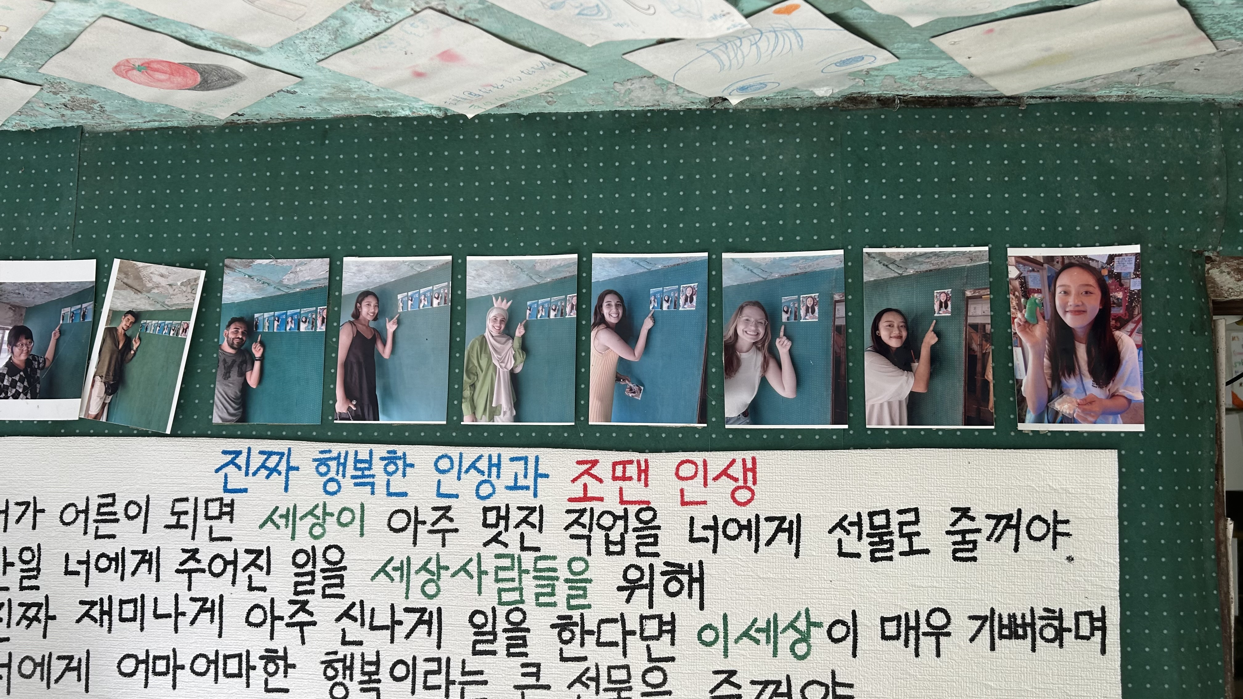 Funny recursive photo of people pointing at photos of people pointing inside DUF Coffee