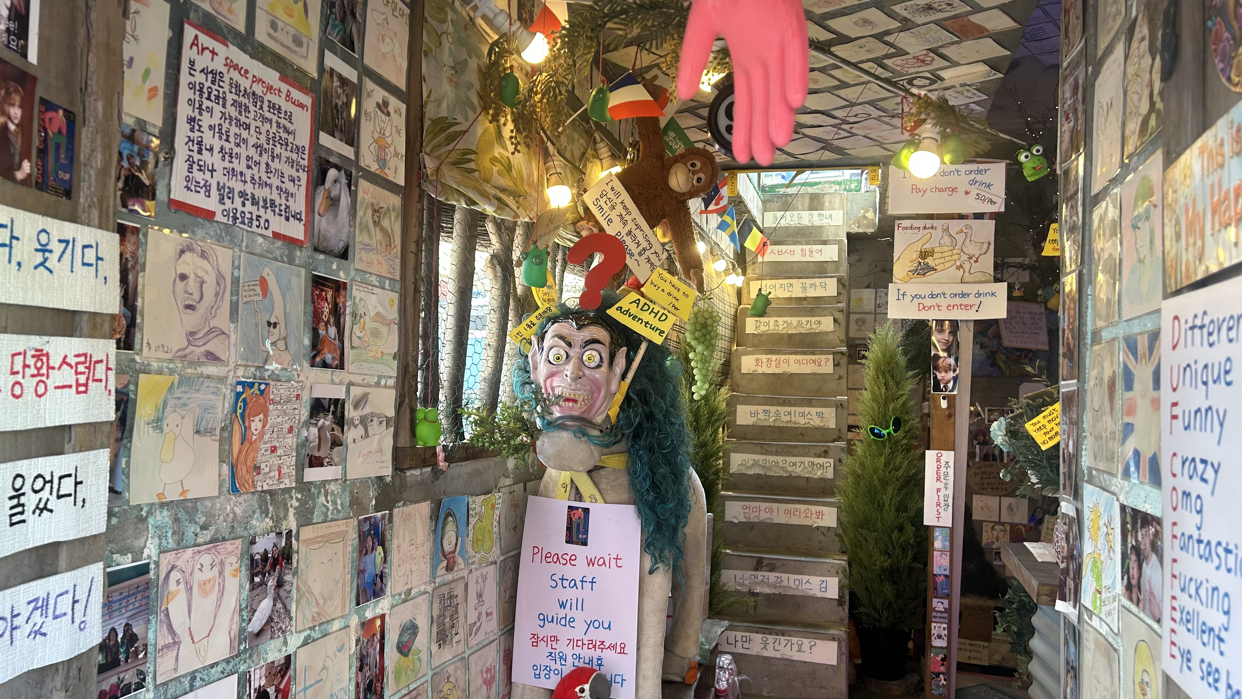 Quirky objects covering the interior of DUF Coffee in Busan