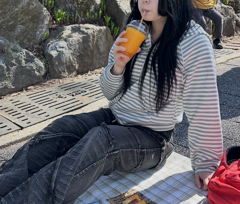 Drinking an orange slushie while cooling down at Everland Zoo